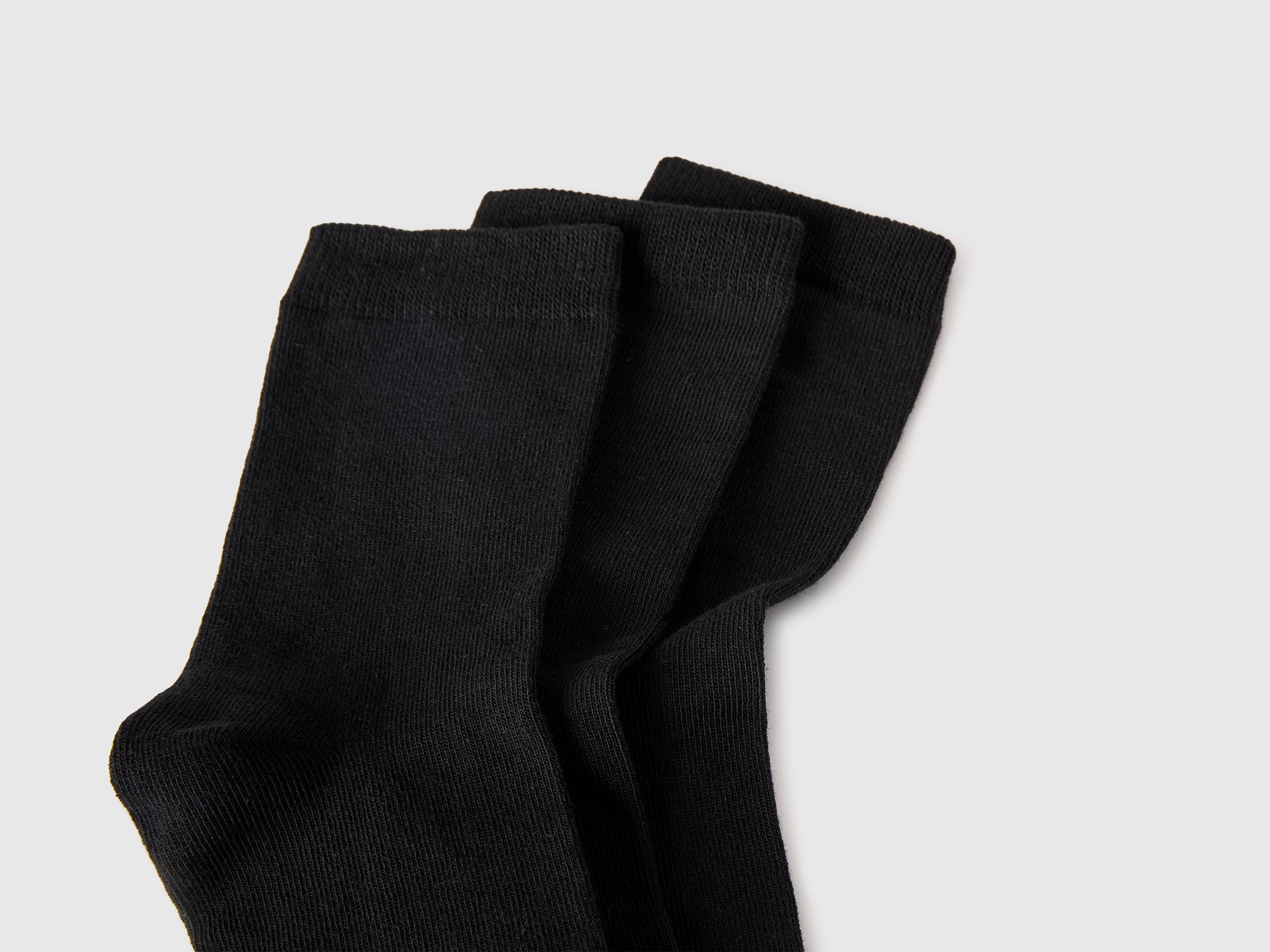 Three pairs of solid-colored medium socks - ucb_image_DS1