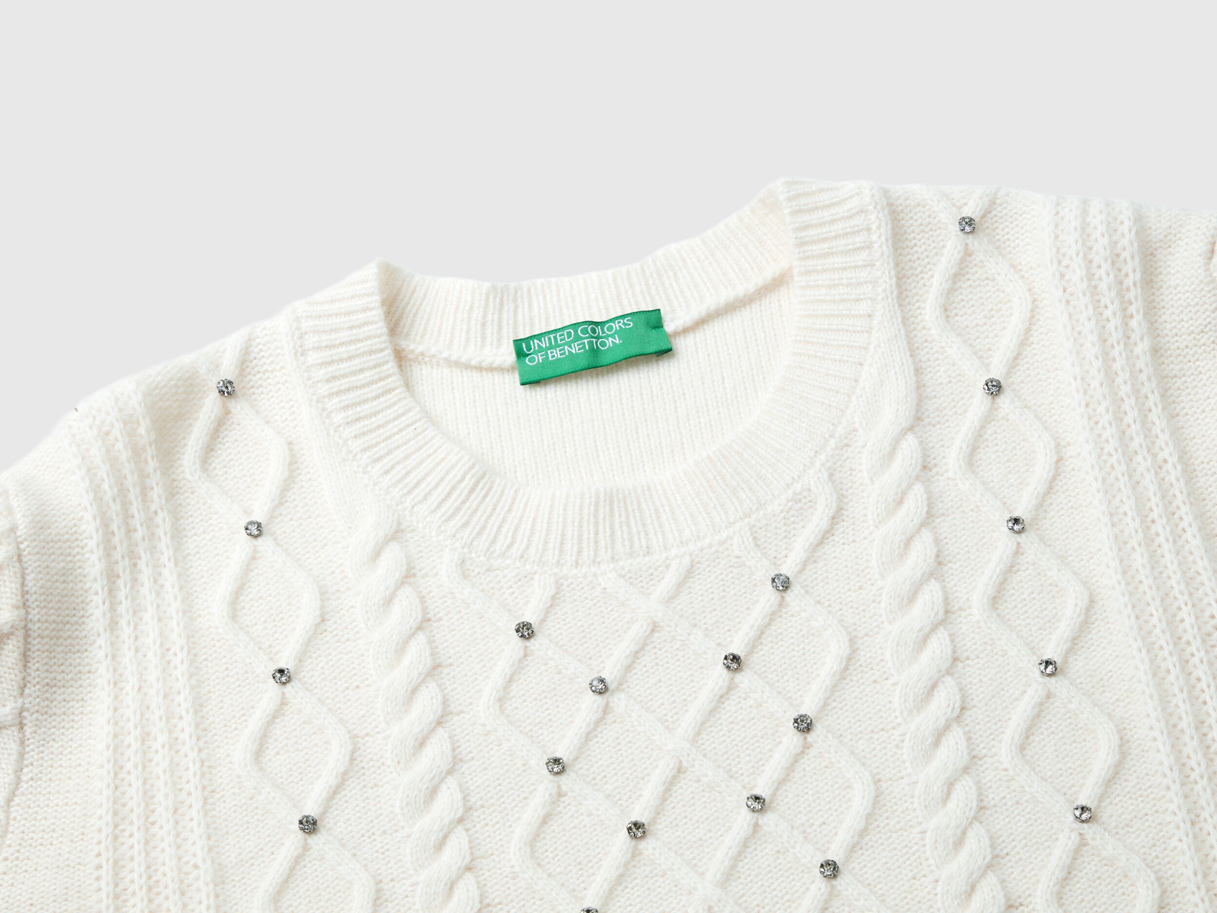 Sweater with cable knit and rhinestones - Creamy White | Benetton