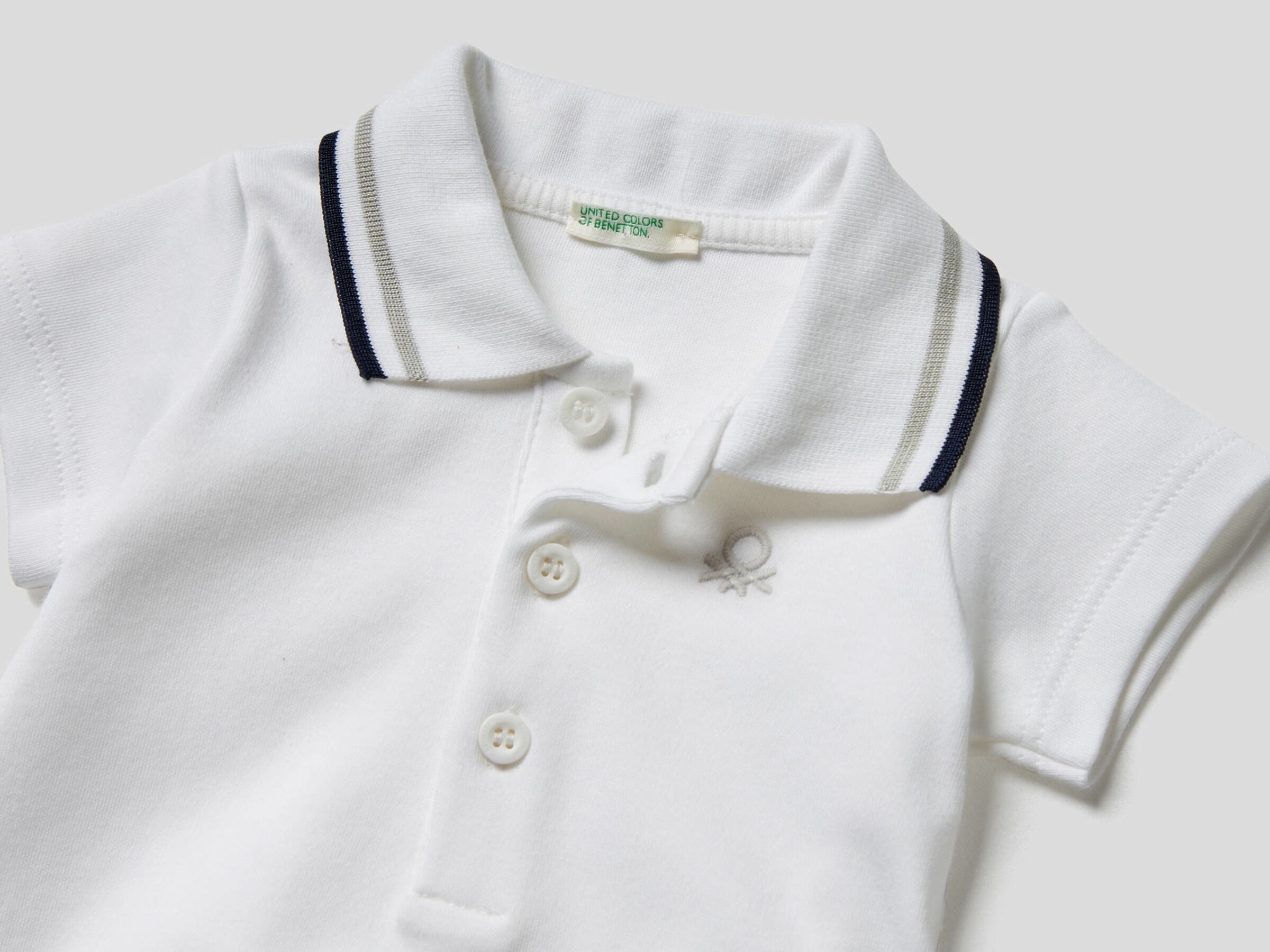 white polo onesie