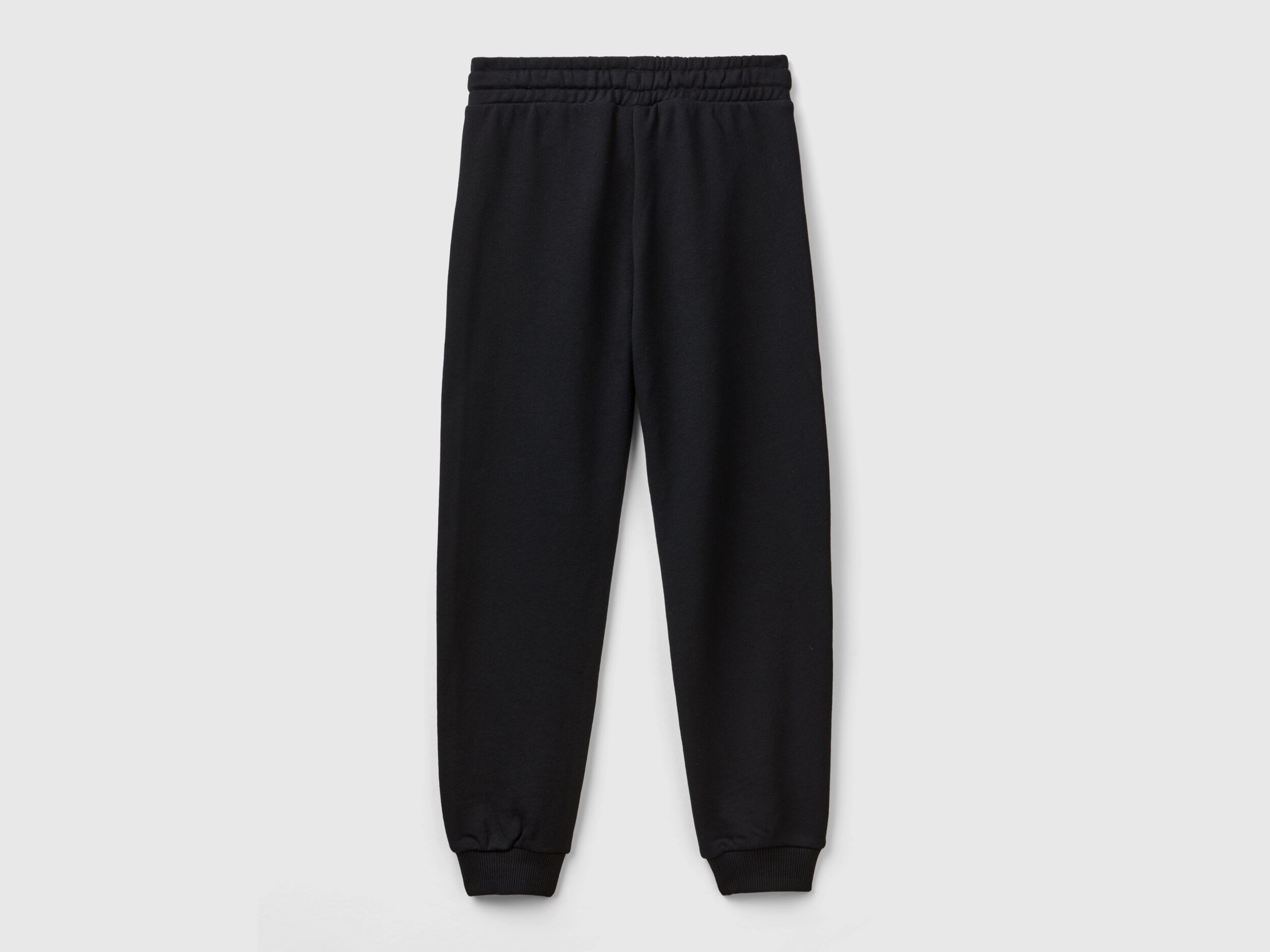 Sweatpants with logo - Black | Benetton