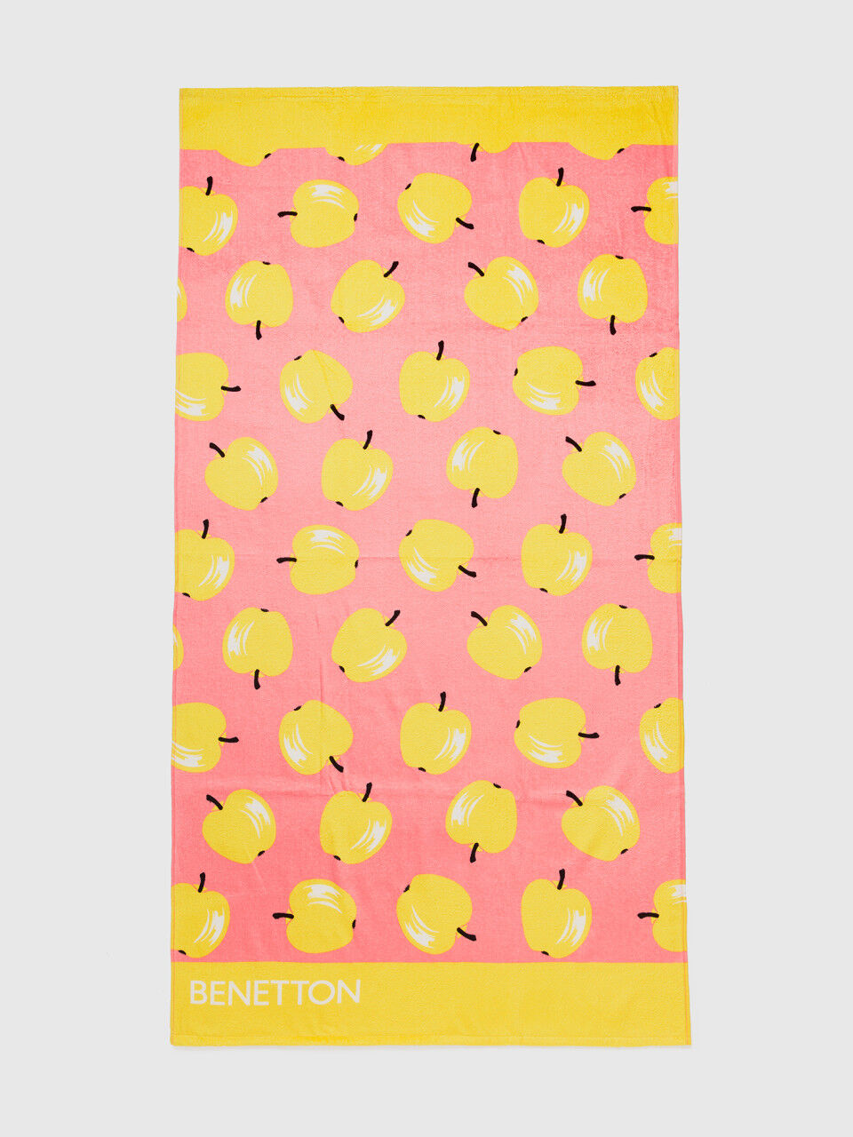 Pink beach towel with apple pattern