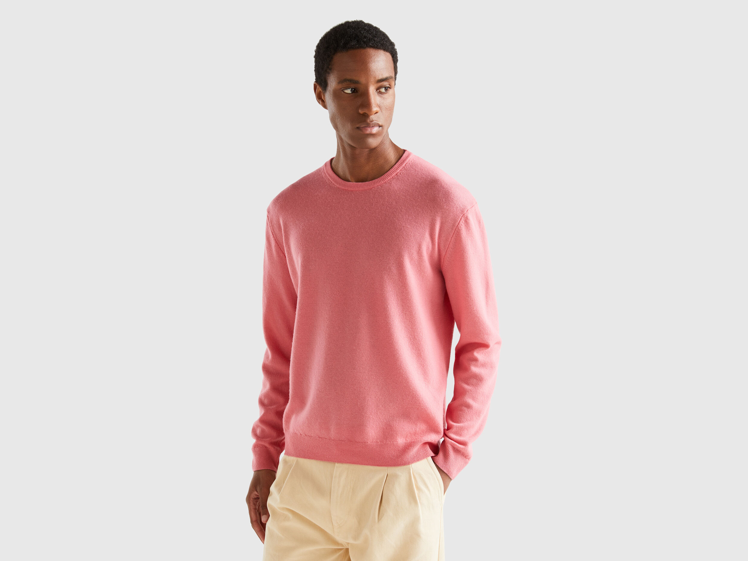 Salmon pink crew neck sweater in pure Merino wool Salmon Benetton