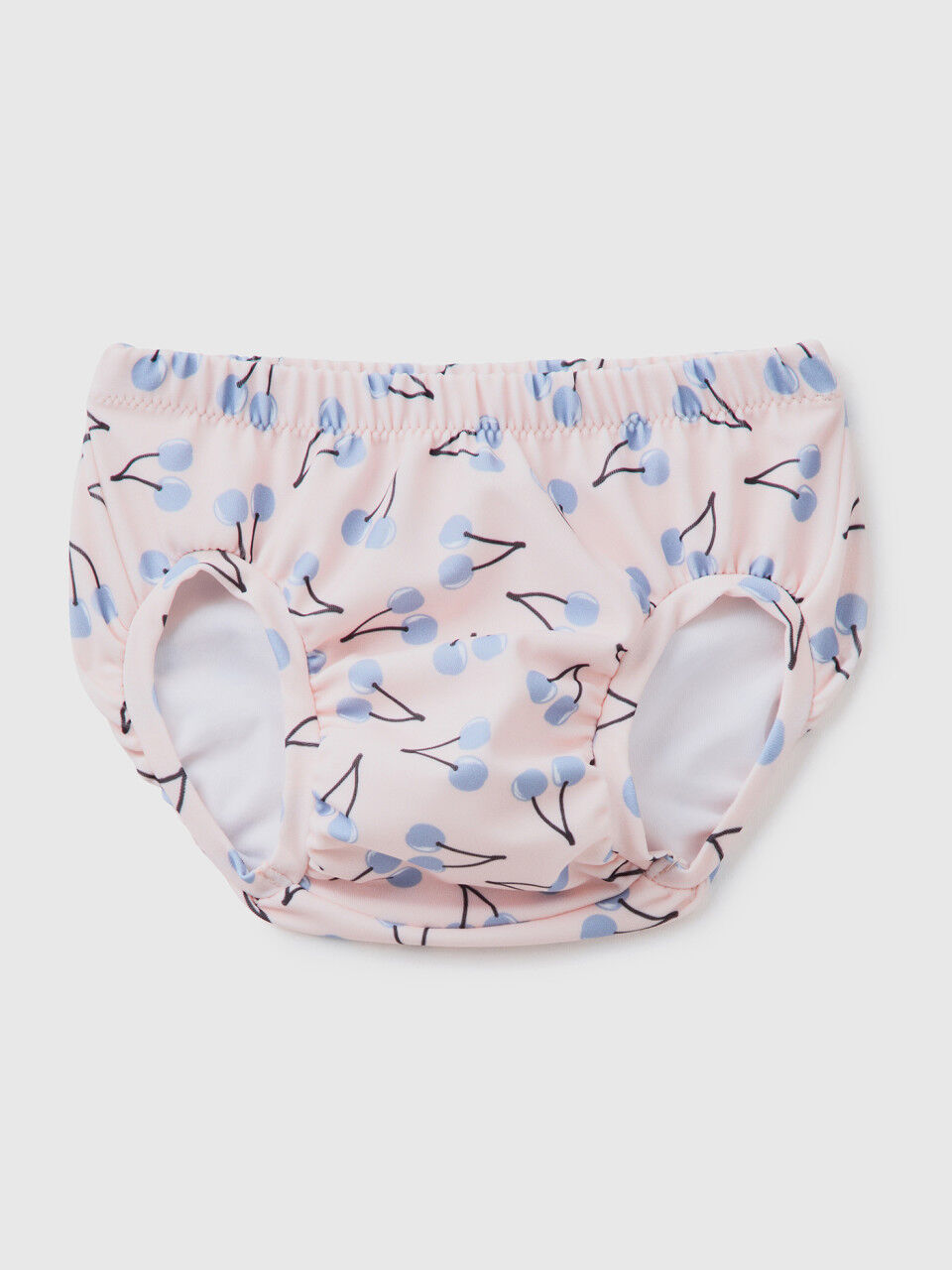 Pink swim bottoms with cherry pattern