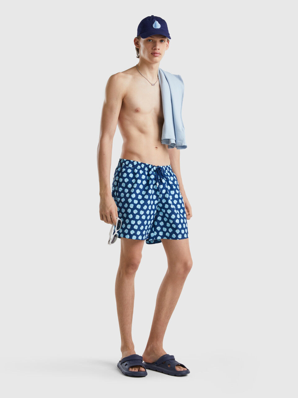 Dark blue swim trunks with apple pattern