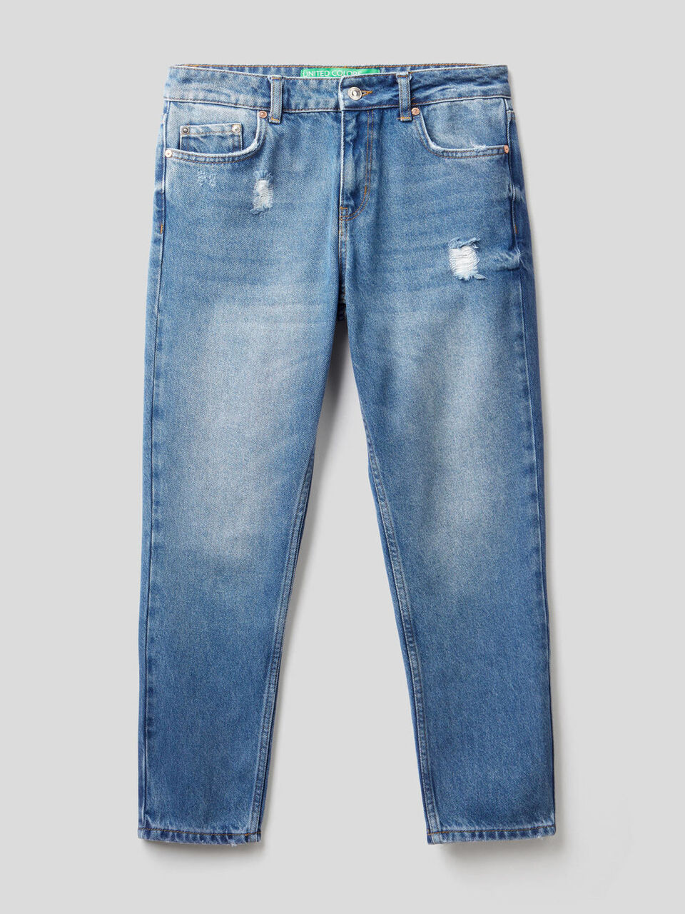 Jeans slim fit con rotture image number 1