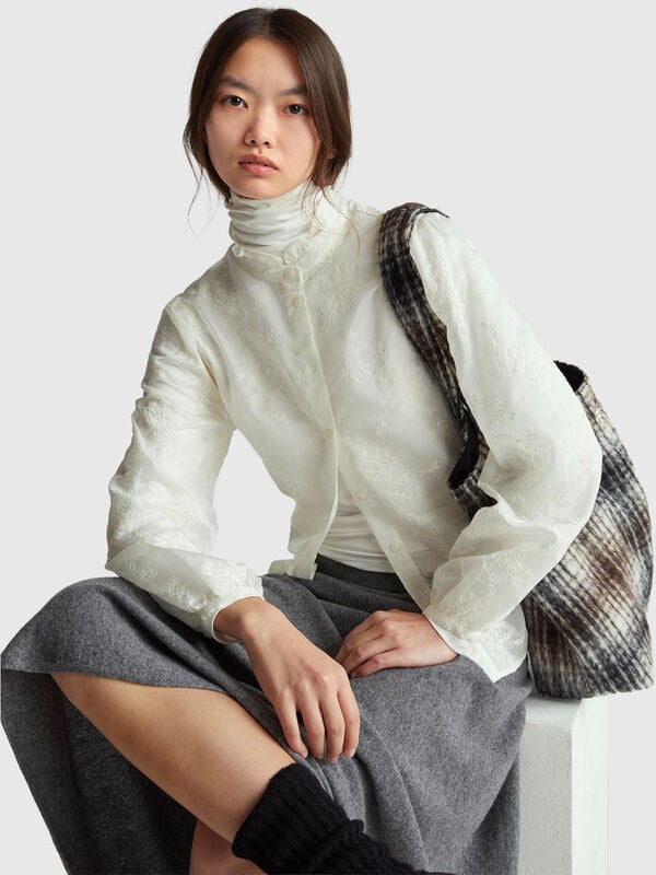 Embroidered blouse with ruffled collar Women