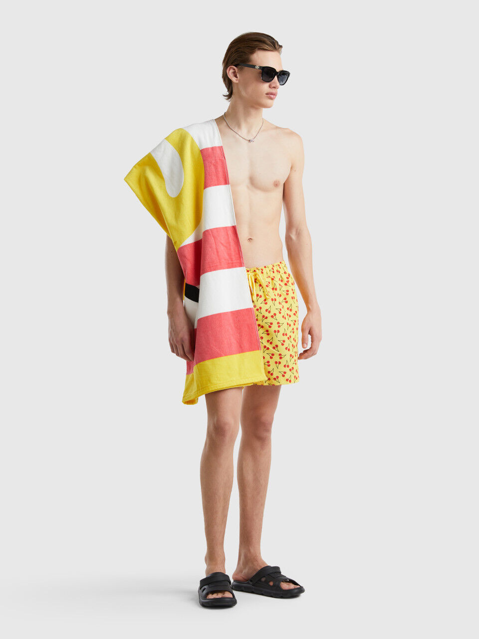 Yellow swim trunks with cherry pattern