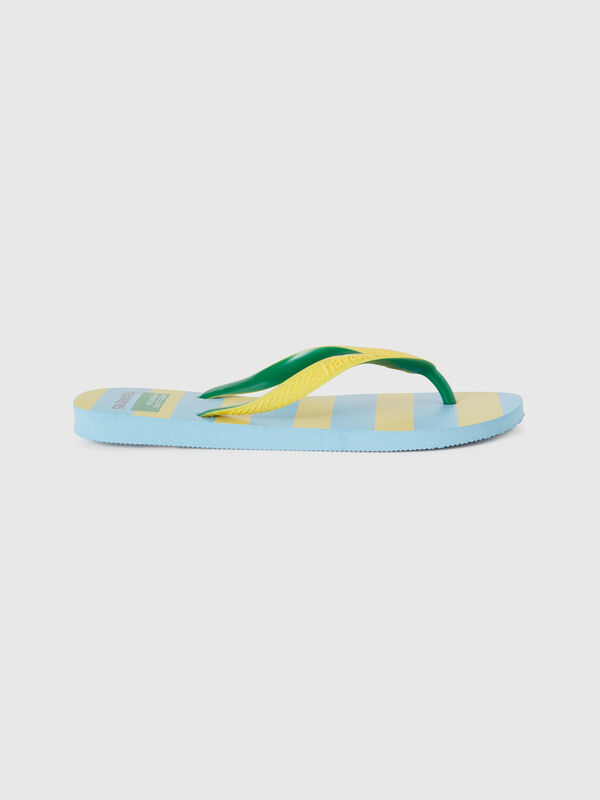 Havaianas flip flops with yellow and light blue stripes